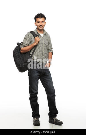 Young man standing with backpack Stock Photo