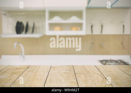 kitchen background with wooden table top in modern home vintage color tone Stock Photo