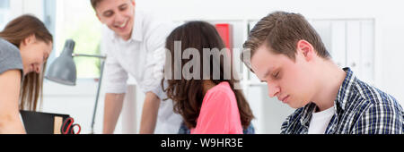 A man programmer fell asleep at meeting Stock Photo