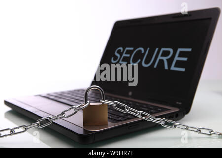 Chain and lock on laptop Stock Photo