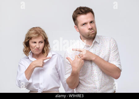 Conflict bad relationships. Two people pointing fingers at each other Stock Photo