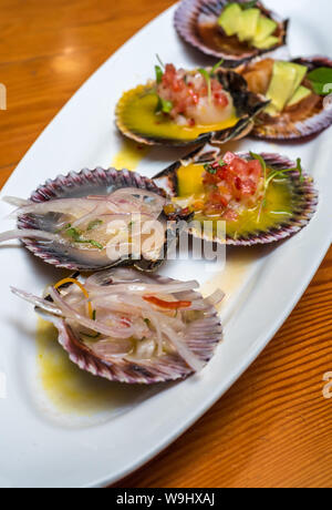 fresh scallops new peruvian cuisine style Stock Photo