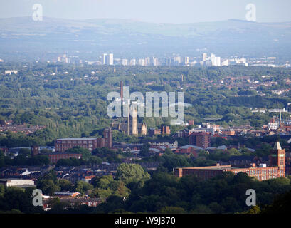 View looking over the town Bolton with the City of Manchester in the distance, Falcon Mill lower right, Bolton Parish Church central. photo DON TONGE Stock Photo