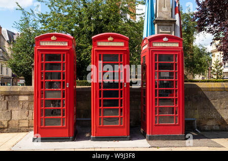 Red telephone boxes in a row three red phone boxes phone kiosk telephone boxes Northampton town centre Northamptonshire England UK GB Europe Stock Photo