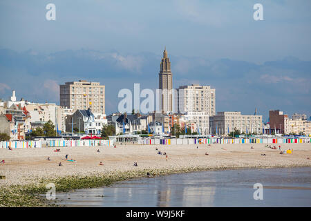 A view of the beach at Le Havre, Normandy, France with St. joseph's Catholic Church and Auguste Perret flats Stock Photo