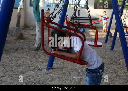Khan Younis, Gaza Strip, Palestinian Territory. 13th Sep, 2019. Palestinian children play at a park during an event to celebrate Eid al-Adha festival, in Khan Younis in the southern Gaza Strip, August 13, 2019 Credit: Mariam Dagga/APA Images/ZUMA Wire/Alamy Live News Stock Photo
