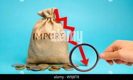 Money bag with the word Import and down arrow. The fall of imports. Reducing the competitiveness of imported goods. Sanctions and embargoes. Economic Stock Photo