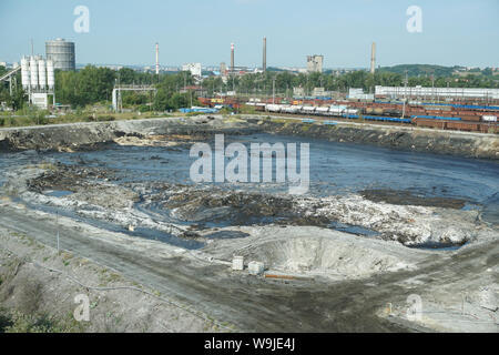 Former dump toxic waste in Ostrava, oil lagoon. Effects nature from contaminated water and soil with chemicals and oil, environmental disaster Stock Photo