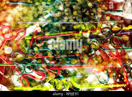 Neon plastic straws for drinks. Modern and trendy version of holiday concept. Stock Photo