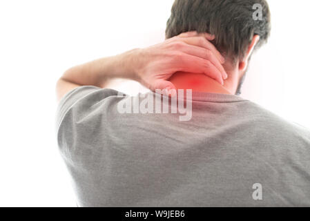 rear view of man suffering from neck pain Stock Photo