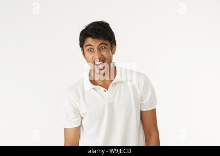 Young man looking shocked Stock Photo