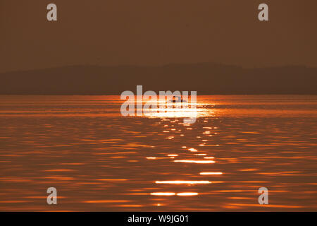Golden African Sun set over Lake Kariba, Zimbabwe Stock Photo