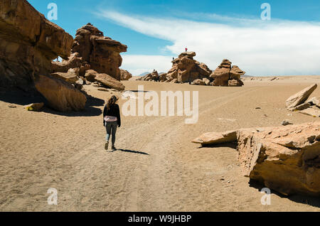 Girl walking alone in the desert of Uyuni in Bolivia Stock Photo