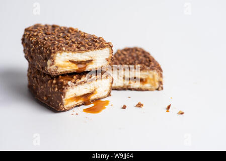 Chocolate bars with crushed peanuts and caramel stuffing Stock Photo