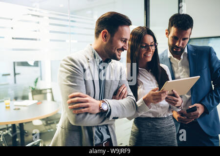 Picture of businesspeople using digital tablet in office Stock Photo