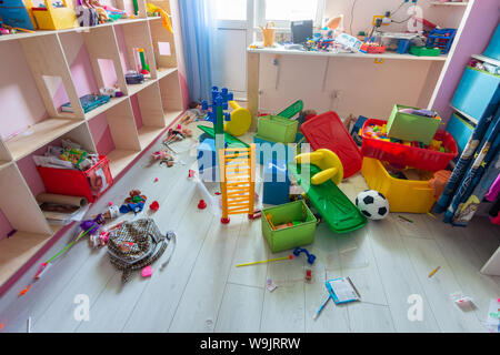 Anapa, Russia - August 8, 2019: mess in the children's room, scattered toys, boxes on the floor Stock Photo