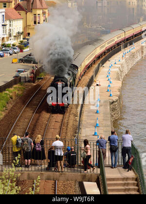 The English Riviera Express passing through Dawlish, hauled by West Country class pacific No 34046 'Braunton'. 7th July 2019. Stock Photo