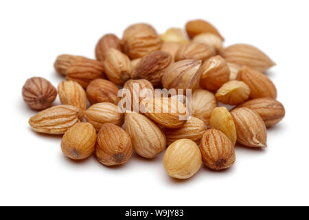 Heap of mahlep or mahaleb seeds isolated on white background Stock Photo