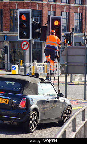 maintenance engineer working on traffic light system in the city of leeds yorkshire united kingdom Stock Photo