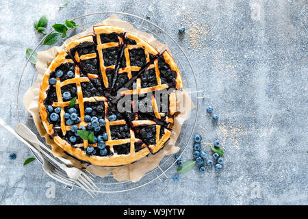 Traditional homemade american blueberry pie with lattice pastry, top view Stock Photo