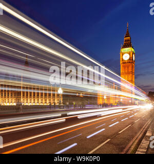 Motion blurred red double decker bus, Houses of Parliament, Big Ben, Westminster Bridge, London, England, United Kingdom, Europe Stock Photo