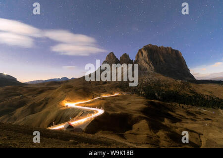 Lights of car trails with Sassopiatto in the background, Dolomites, South Tyrol, Italy, Europe Stock Photo