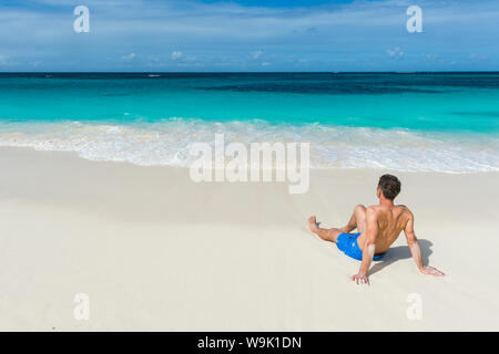 Man relaxing on the world class Shoal Bay East beach, Anguilla, British Oversea territory, West Indies, Caribbean, Central America Stock Photo