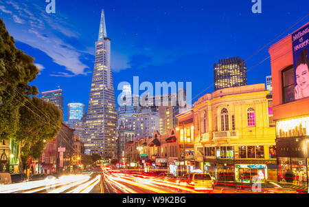 View of Transamerica Pyramid building on Columbus Avenue and car trail lights, San Francisco, California, United States of America, North America Stock Photo