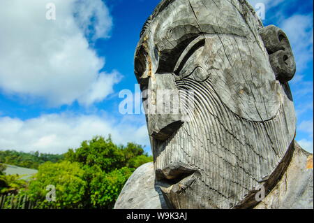 Traditional wood carved mask in the Te Puia Maori Cultural Center, Rotorura, North Island, New Zealand, Pacific Stock Photo