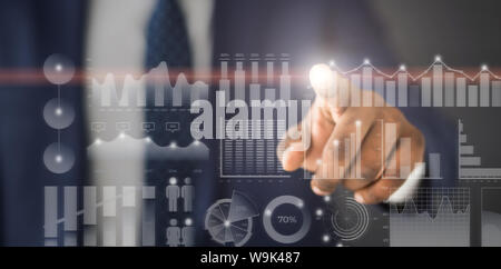 Businessman choosing one annual data diagram among others Stock Photo