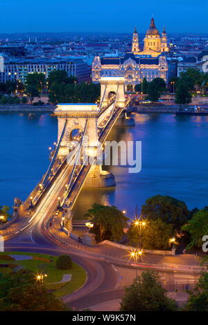 Chain Bridge, Four Seasons Hotel, Gresham Palace and St. Stephen's Basilica at dusk, UNESCO World Heritage Site, Budapest, Hungary, Europe Stock Photo