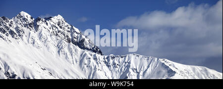 Snowy sunlight mountains at nice winter day. Panoramic view from chairlift on Hatsvali, Svaneti region of Georgia. Caucasus Mountains. Stock Photo