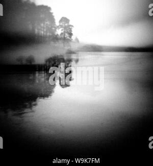 Image taken with a Holga medium format 120 film toy camera of misty view of Blea Tarn at dawn, Lake District, Cumbria, England, United Kingdom, Europe Stock Photo