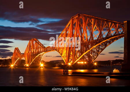 Forth Rail Bridge over the River Forth illuminated at night, South Queensferry, Edinburgh, Midlothian, Scotland, United Kingdom, Europe Stock Photo