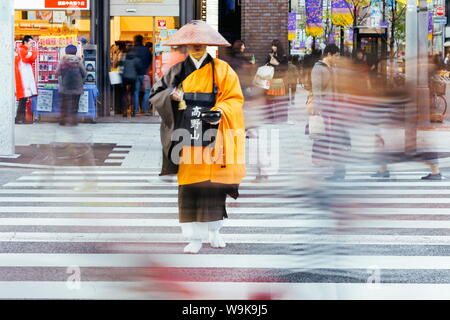 Shinto monk in traditional dress collecting alms (donations), Ginza, Tokyo, Honshu, Japan, Asia Stock Photo