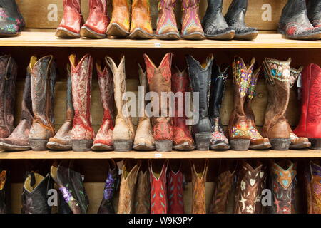 Cowboy boots lining the shelves, Austin, Texas, United States of America, North America Stock Photo