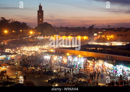 View over market square at dusk, Place Jemaa El Fna, Marrakesh, Morocco, North Africa, Africa Stock Photo