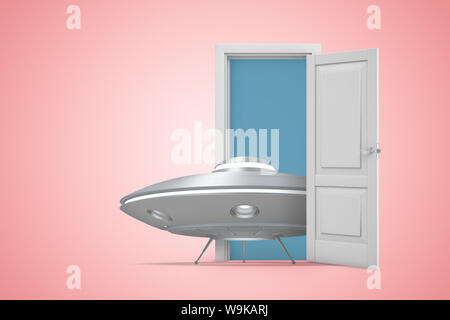 3d rendering of small grey shiny UFO standing in open door on pink background. Stock Photo