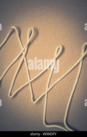 white rope randomly laid in zig zag pattern Stock Photo