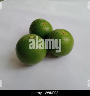 Three sweet lime (sweet limetta) fruits on a white background Stock Photo