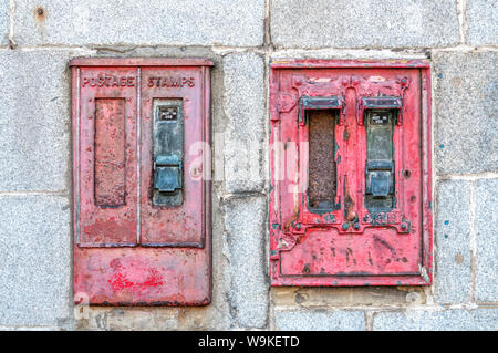 A pair of old unused postage stamp vending machines in Aberdeen. Stock Photo