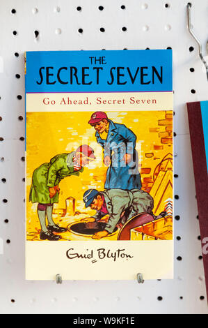 Copy of Go Ahead, Secret Seven by Enid Blyton for sale in bookshop window. First published in 1953. One of her Secret Seven series of children's books Stock Photo