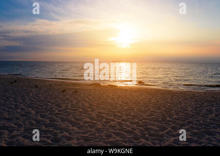 Beautiful sunset on the beach and sea Stock Photo