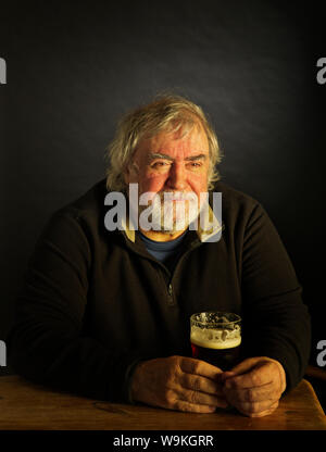 Man with pint of beer Stock Photo