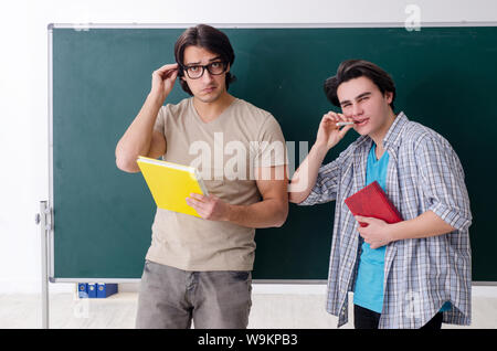 The two male students in the classroom Stock Photo