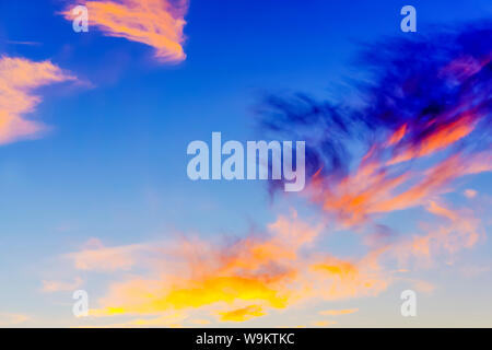 background - evening sky with bright multicolored clouds Stock Photo