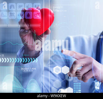 The woman doctor in telemedicine cardiology concept Stock Photo