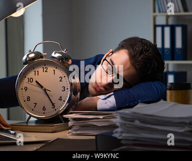 The businessman falling asleep during long hours in office Stock Photo