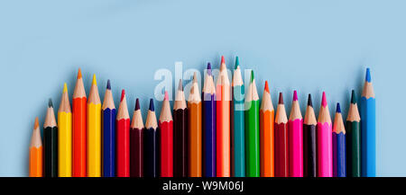 background from color pencils on blue paper Stock Photo