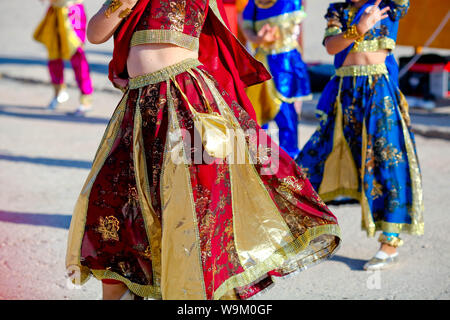 Beautiful belly dancer in red outfit holding veil, isolated Stock Photo ...